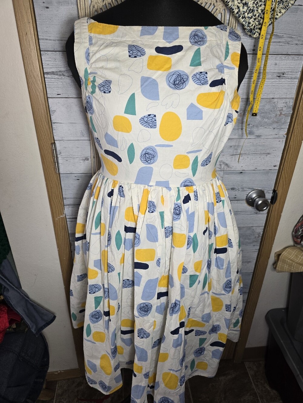 Vintage-Inspired Sleeveless Cotton Dress in White with Yellow & Blue Print